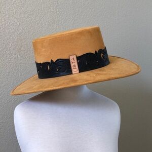 Waterproof suede hat with tooled leather band.